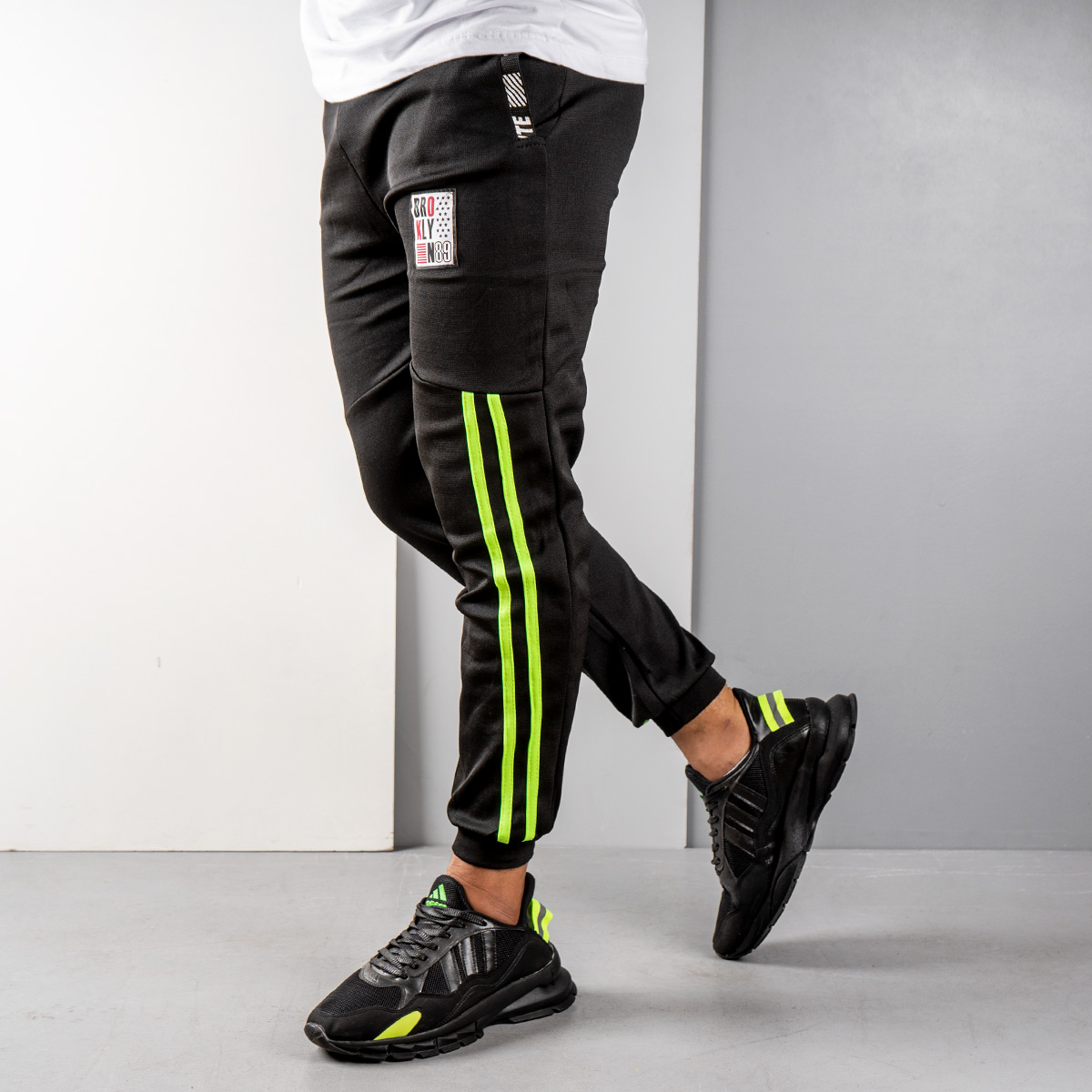 شلوار اسلش مردانه مشکی سبز مدل G52(T)