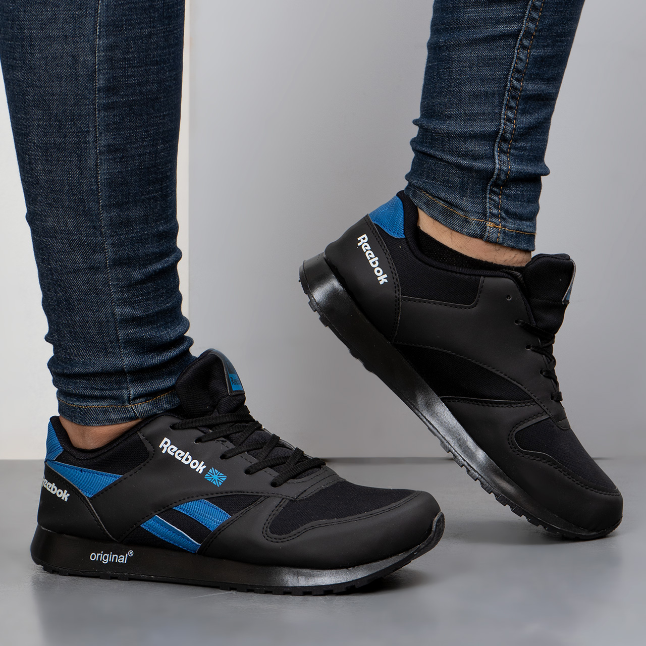 کفش ورزشی Reebok مشکی آبی مردانه مدلRako